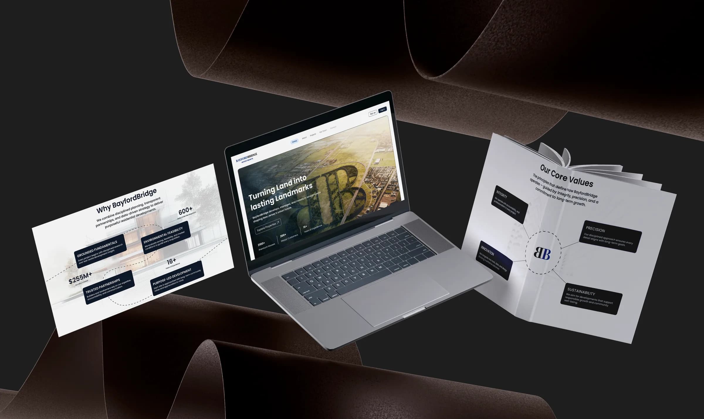 BayfordBridge website on a laptop beside a printed brochure, dark studio scene